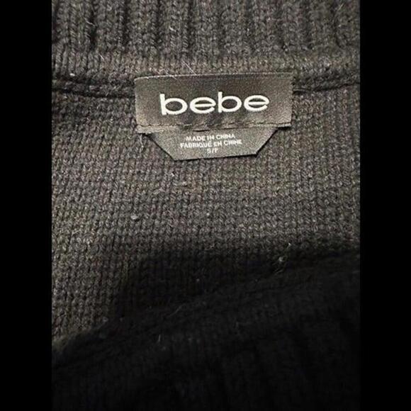 Bebe Sweater with an off-the-shoulder Black Ringstone design - Picture 2 of 2